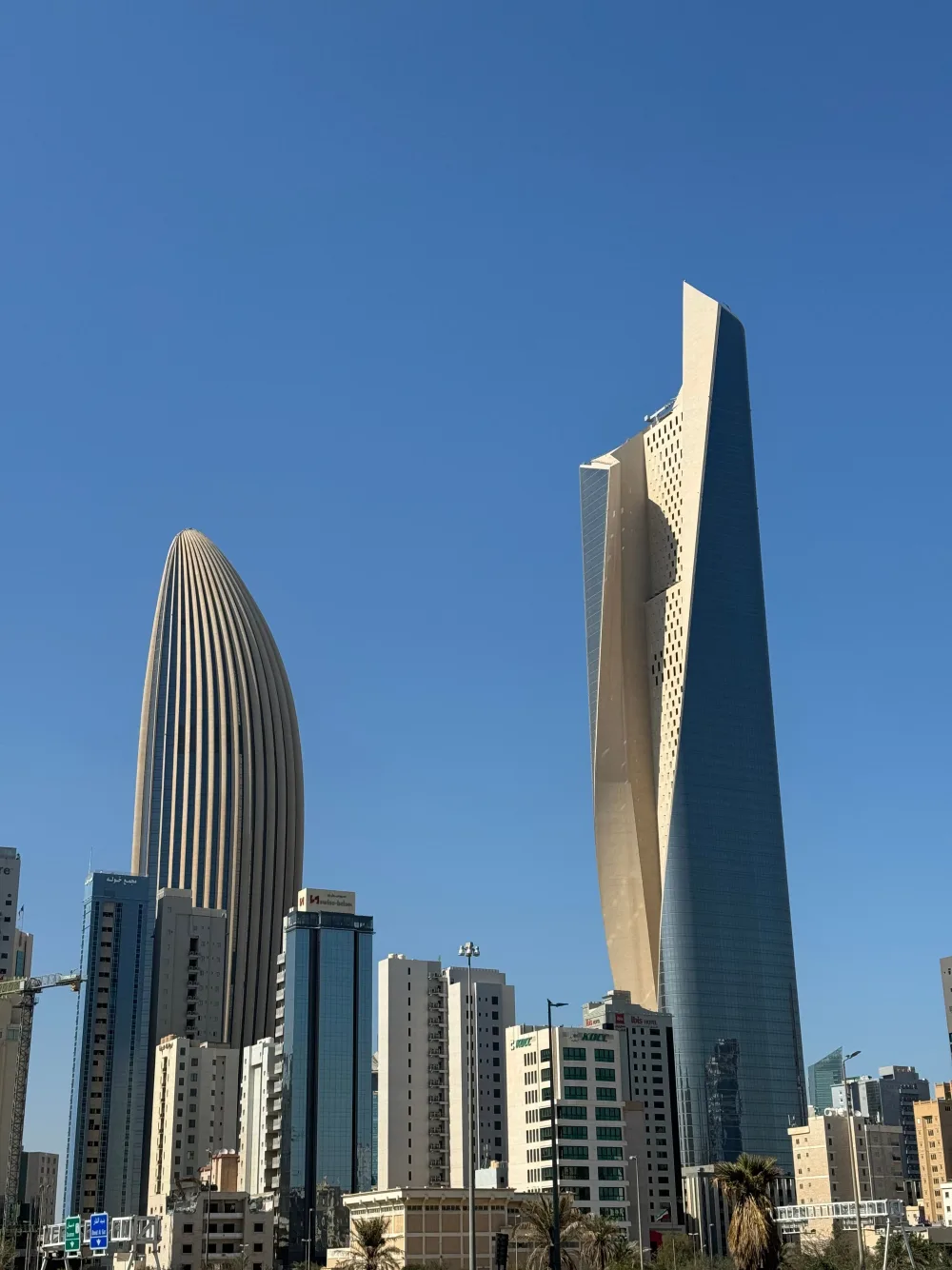 Al Hamra Tower's distinctive twisting facade rising above Kuwait City